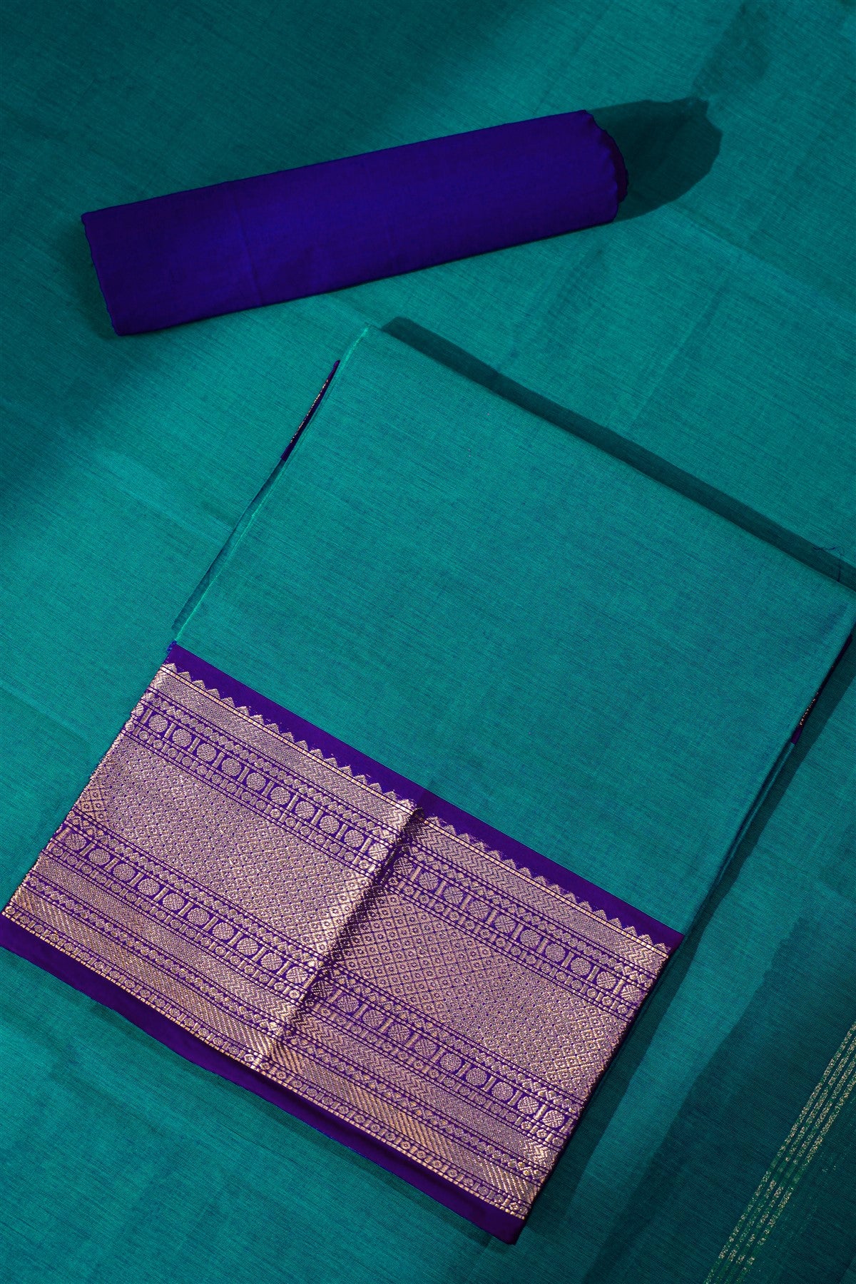 Cotton Teal And Purple Zari Bordered Dress Material